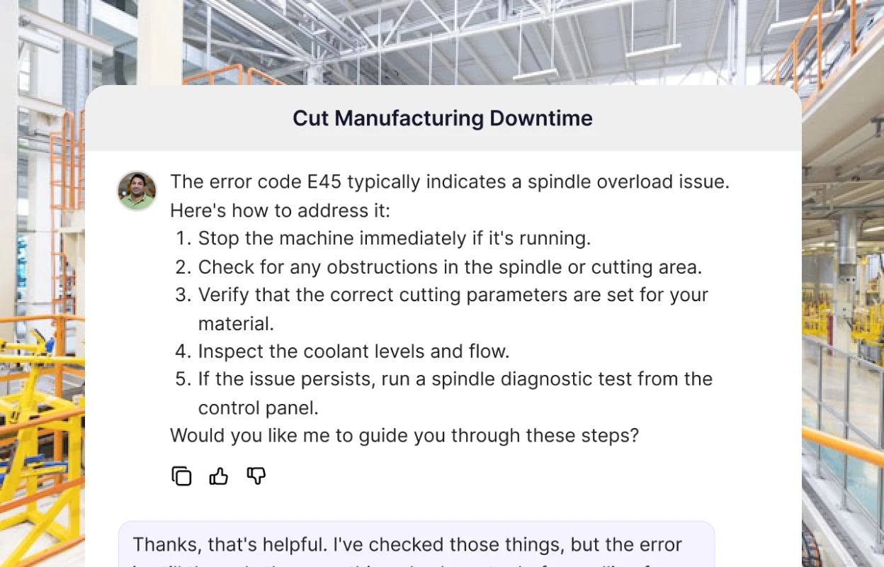 A manufacturing assistant walking an operator through clearing error code E45 on a spindle, step by step, over a factory floor.